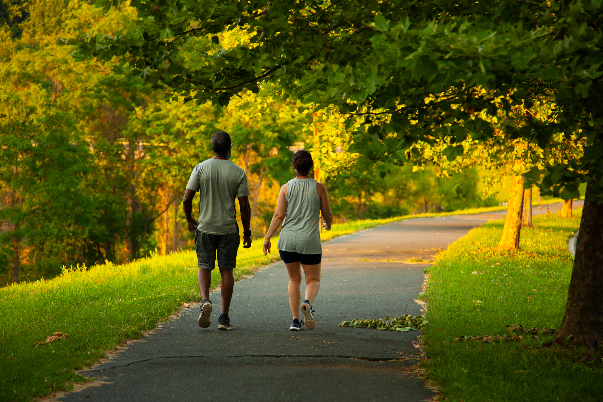 Couple walking through scenic Idlewood Park, just 2 minutes from Weber Yards